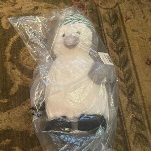 Macy’s Holiday Lane penguin plush with hat